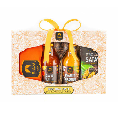 Set of barbecue sauces and a wooden spoon in a decorative box with 'Siam' branding.