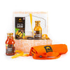 Gourmet gift set with Siam BBQ products including bottles and a mat on a white background