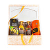 Gourmet gift set with barbecue kit and sauces in a decorative box.