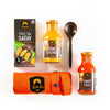 SIAM BBQ kit with Satay sauce, peanut coconut sauce, sweet chili sauce, and a wooden spoon on a white background.