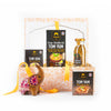 Gift basket with Siam brand food products including soup noodles and seasoning on a white background