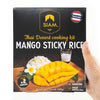 Box of Siam Mango Sticky Rice dessert kit held by a hand
