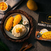 Mango dessert with rice and a box of Siam Mango Sticks on a dark surface.