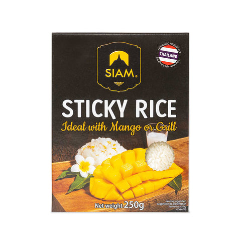 Box of Siam Sticky Rice with mango and rice on a wooden board